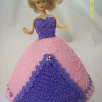 Barbie Doll Customer asked for a pink and purple cake with a doll. She loved it! All buttercream.