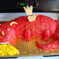 Red Dragon This cake was a request for this weekend for a little boys birthday... Vanilla cake with Vanilla Buttercream, Rice treat head and tail. The...