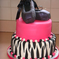 Ballet Slippers 10-8 round Vanilla cake and Chocolate buttercream. Slippers are rice crispy treats covered in fondant