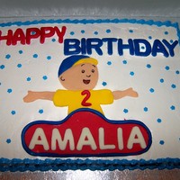 Caillou Cake 11x15 inch buttercream cake with fondant cutouts of Caillou