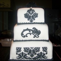 Lindsy's 30Th Birthday Damask in royal icing. Black fondant roses on top.
