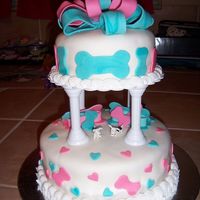 Dog Wedding 6" top cake and 8" bottom cake with coconut filling. Buttercream icing covered with fondant and fondant accents.