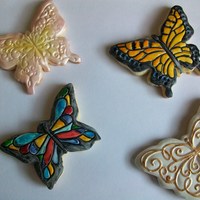 Butterfly Cookies My first attempt at decorating cookies. Sugar cookies covered in fondant, 2 hand painted to acheive a watercolor effect. 2 airbrushed with...