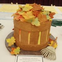 Fall Leaf Basket Basket of leaves for school auction. Leaves made out of chocolate. MMF basket, gumpaste rake.