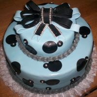 Elegant Baby Shower made with fondant and accented with silver pearls