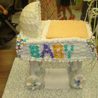 Baby Carraige This picture is an actual cake decorated. The cover/hood is make or royal icing. It was harder to make then it looks. I know it looks bad,...