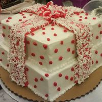 Birthday Presents 2 "tiers" (4 layers all together) 1/2 & 1/2 cake. Buttercream icing. This was a "birthday" gift that a friend...