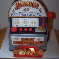Jackpot! All cake covered in fondant. Hand painted wording with food coloring. Finished off with chocolate coins.
