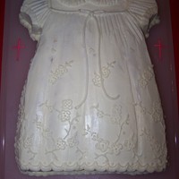 Christening Cake Christening cake made as a replica of the baby's dress. Sculpted cake out of a rectangle pan. Buttercream icing.