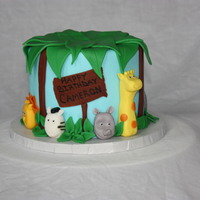 Animals In The Brush 6" Round iced in fondant with animals hand made from fondant. Fondant leaves on top.