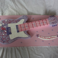 Hannah Montana Guitar Cake 9x13 & 8" square cake carved into guitar shape, torted, filled and covered in fondant.