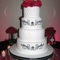 Quilted With Scrolls 6" 8" 10" 12" Rounds iced in fondant. 6" & 10" tiers quilted and with sugar pearls at the intersections....
