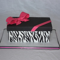 Zebra Gift Box 9x13 Sheet cut in half and stacked. Iced in fondant with fondant lid and bow. Zebra stripes out of fondant. Lid opened up to reveal a...