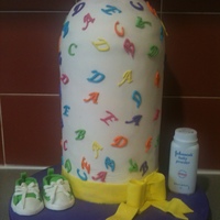 Giant Baby Bottle Cake 3 x 6" cakes - 2 are dark choc mud and the other one is a caramel mudcake with dark choc ganache. All edible except for the baby...