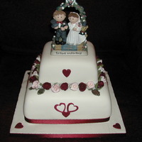 Til Death Do Us Part The cake was designed around the clay figures that were given as a present to the couple.