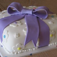 Purple Package This was a cake I made during my Wilton Course 3 class.10" square cake covered with MMF and all decorations done in MMF.