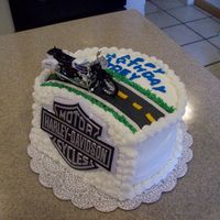 Motorcycle Cake This was for my son's birthday this year. He picked out the motorcycle and the Harley logo and let me use my imagination. The front of...