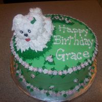 Puppy Birthday This cake was made for a friend of my Aunt. It had to travel quite some way and the icing on the puppy worked it's way off before I...