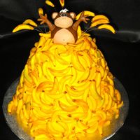 Monkey Business! Monkey & banana mountain bday cake for an adult. Abt 150 (we lost track) hand-rolled & painted fondant bananas. Chocolate Fudge...