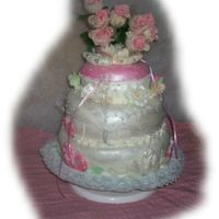 Happy Mothers Day Three flavors, raspberry, coconut, strawberry three layers.Raspberry filling, butter cream frosting, Fondant topping, with gumpaste Roses...