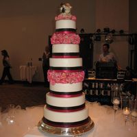 My First Wedding Cake. These are all dummy layers covered in fondant. The bottom layer is cut out with a section of real cake for the "cake cutting".