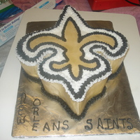 New Orleans Logo This cake was made for a co-worker. The cake was carved out of pound cake in a 1/4 sheet pan. The icing is buttercream. I also airbrushed...