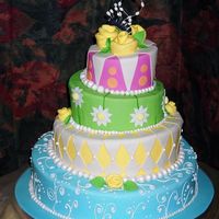 Topsy Turvy Wedding Cake was made up of a 6", 8" 10" & 14". All decorations were of fondant.