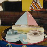 Sail On.. All cakes were covered in fondant, cut and shaped into a nautical theme. Sailboat sails were made out of gumpaste.