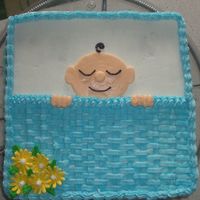 Sleeping Baby Boy... I made this cake for my sister and sister-in-law who had babies 1 day apart...Baby blaket is basket weave, with royal icing daisies in...