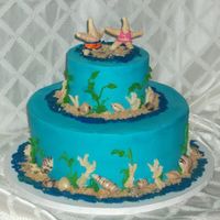 Co-Ed Wedding Shower 12" Hazelnet cake w/Hazelnut crean and Cho ganache, 6" Cho cake w/ Cho Ganache. BC, Chocolate Shells, Starfish w/ royal icing...