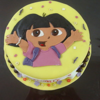 Dora Cake 8" choco cake covered in fondant. accents are fondant. all edible.