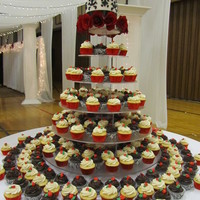Red And Black Wedding This was for a wedding just before Christmas. Damask design on cutting cake and damask and red foil wrappers on cupcakes.