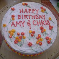Birthday_Cake.jpg Cake decorated with red and orange/yellow drop flowers for my sister-in-law and my husband's birthdays. It was a hit, mostly because...