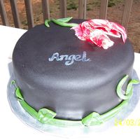 Tulip? This is my very first fondant cake......Vegan style. You know.....no butter,eggs,milk, etc.....The flav is a yellow amaretto cake with a...