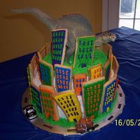 Godzilla This cake was for my son's 3rd birthday. He loves cars and dinosours, so I thought this would be great. I love the way it turned out....