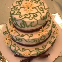 Wedding Shower Cake Kind of sloppily-iced...I was really short on time. But it was still pretty...! Little gumpaste flower and buttercream vines. Plus a brown...