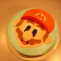 Mario Cake!! So fun to make. Haha. I'm always happy to get a mario order! (first time) :] He's fondant on top of some good ol'...