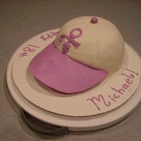 Prince Symbol Baseball Hat My prince-obesessed friend turned 18. :] Baked in a bowl, covered in fondant, gumpaste visor + symbol.