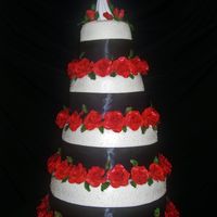 Rows Of Roses 6",9",12",and 15" marble cakes with chocolate truffle filling. Each tier is 7" tall. Gum paste roses and leaves....