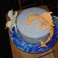 Fantasy Cake The wings on the unicorn had a mind of thier own...lol all fondant...2 characters from debbie brown