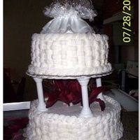 Basketweave Wedding Cake This is my first wedding cake that I made for a friend of mine. Top Tier is Banana bottom White Almond Sour Cream. They loved it!
