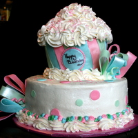 Lilys Birthday Cake I did this about 2 years ago.Buttercream with fondant accents.TFL