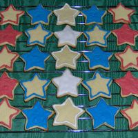4Th Of July Cookies These are sugar cookies with thinned royal icing. I used the largest star shaped fondant cutter to cut them out. Some are covered in icing...