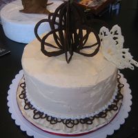 Butterfly Wishes 8" round French Vanilla with fresh strawberries and buttercream filling.Ivory and white buttercream, white and cocoa candymelts for...