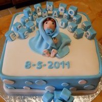 Baby Blue Christianing cake. Vanilla Sponge cake, covered in fondant. Baby and building blocks also fondant.