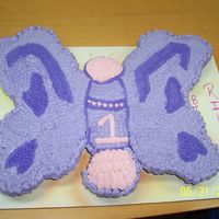 Butterfly Cupcake Cake Cream Cheese Icing 1st attempt, it was harder to ice then I thought. The cupcakes kept moving on the board. 2nd time using cream cheese...