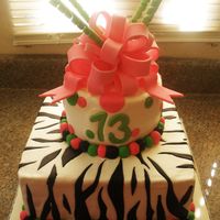 Zebra And Polka Dot Cake This cake was so fun. The bottom tier is 3 layers of zebra striped chocolate and butter cake with chocolate ganache filling. The top tier...