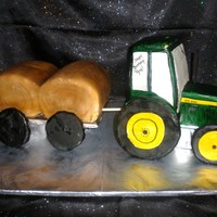 John Deere Tractor With Trailer And Round Hay Bales The tractor is carved buttercake covered in fondant with rice crispy treats for wheels. The trailer is chocolate cake covered in fondant...