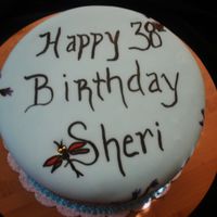 Dragonfly And Bamboo This is a 8" chocolate 4 layer cake with sky blue buttercream and sky blue fondant. Hand painted with bamboo and dragonflies.