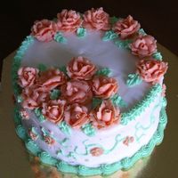 First Attempt At A Floral Cake This is my first floral cake. I'm quite pleased with how it came out in general but the scroll on the side is not the best. It's...